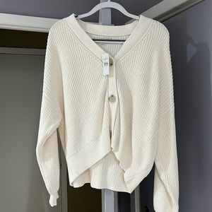 New with tags cream colored short sweater.